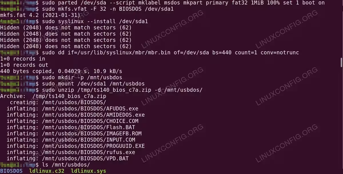 Terminal output showing USB drive partitioning with parted, FAT32 formatting with mkfs.vfat, syslinux installation, and extraction of Lenovo BIOS files into /mnt/usbdos/BIOSDOS/