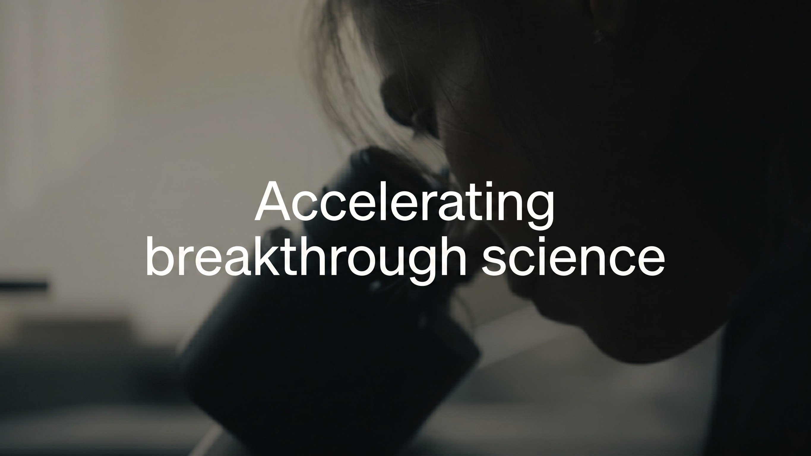 scientist looking through a microscope with “accelerating breakthrough science” overlaid