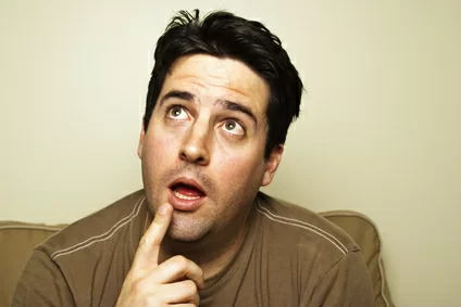Man looks up contemplating